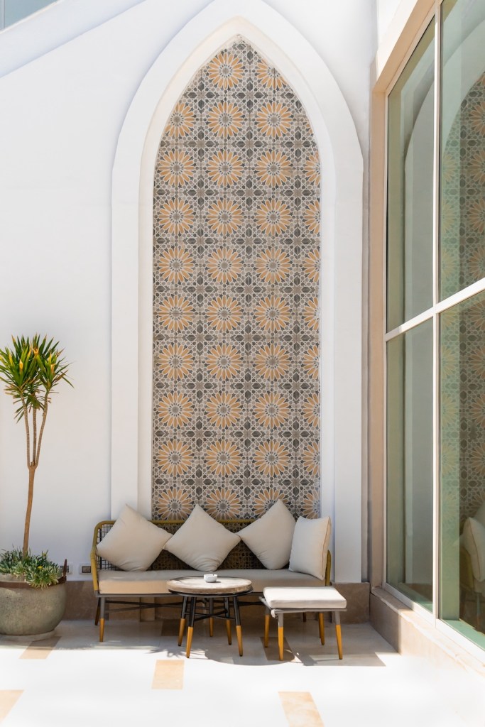 Arabian style terrace with mashrabia pattern and moden sofas with table. Concept of vastu application for villas and houses to create harmony and balanced home.