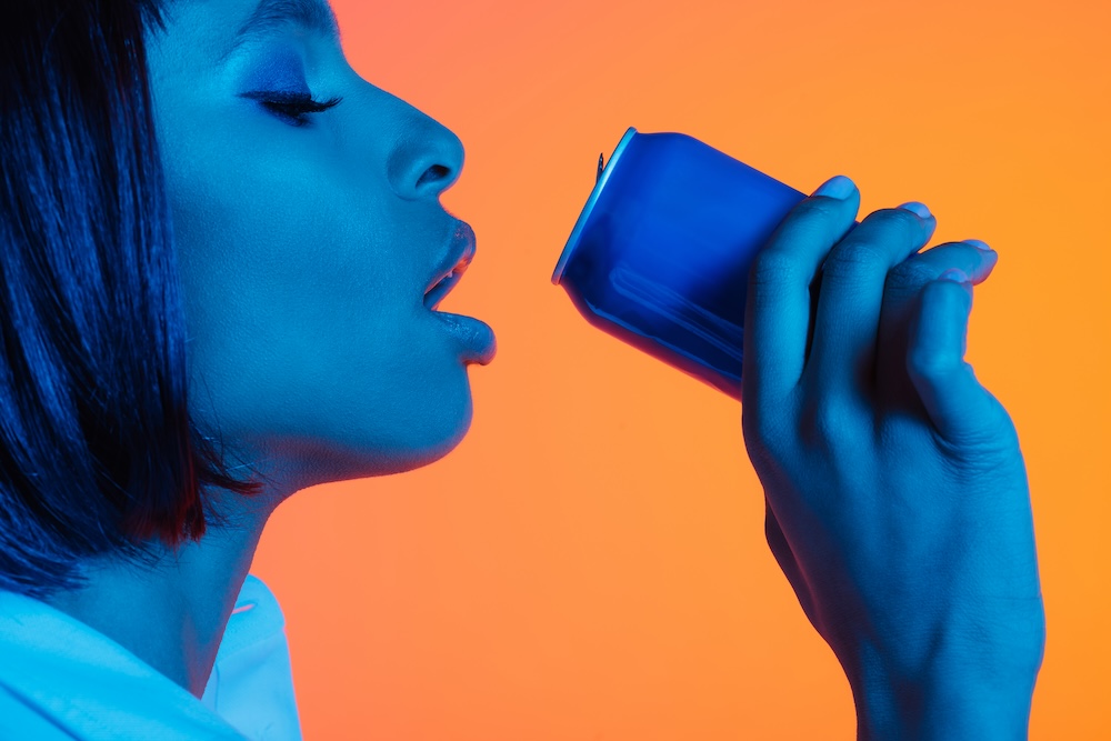 A young girl drinking energy drink. A concept of wellness, mindful life, Vedic knowledge and Ayurveda for health, life balance, peace and sustainable living.